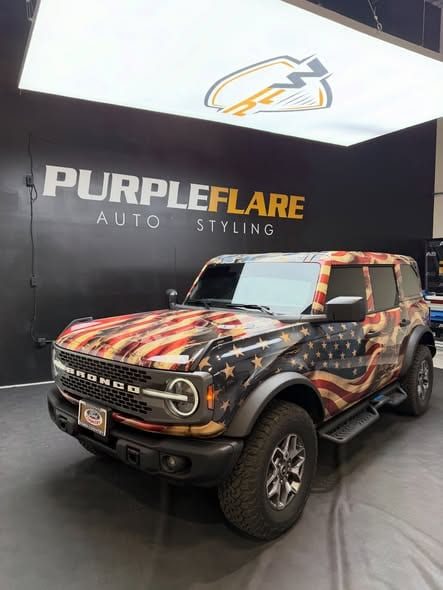 Printed Ppf Ford Bronco In Front Of The Purple Flare Shop Sign